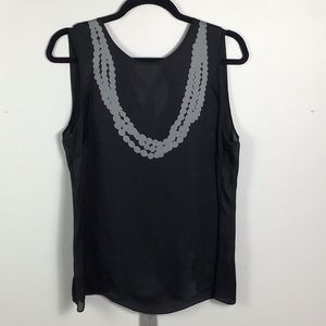Black silk sleeveless top with printed necklace and grosgrain tie back